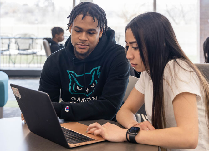 Two students studying at Oakton College.