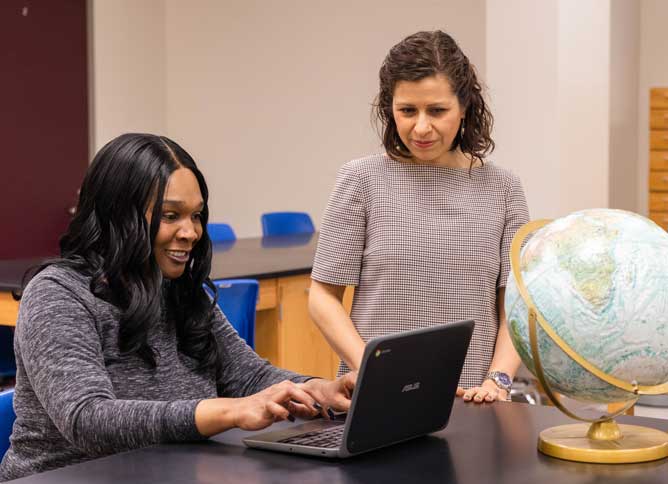 TRIO student working with a professor.