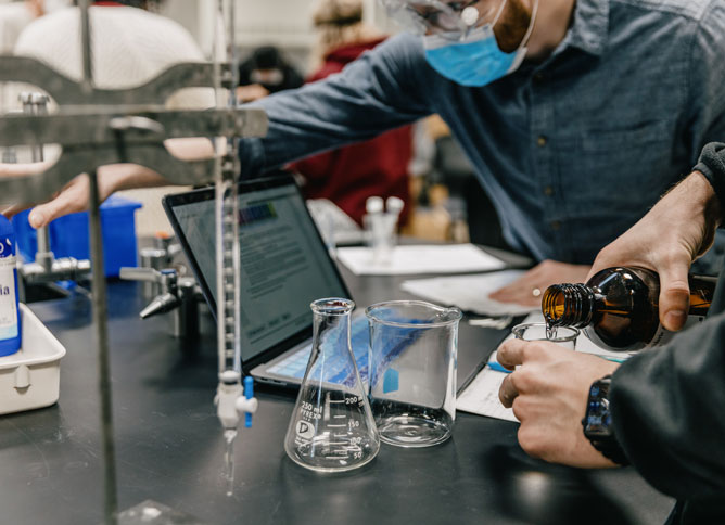 Beakers and chemicals in a science lab.